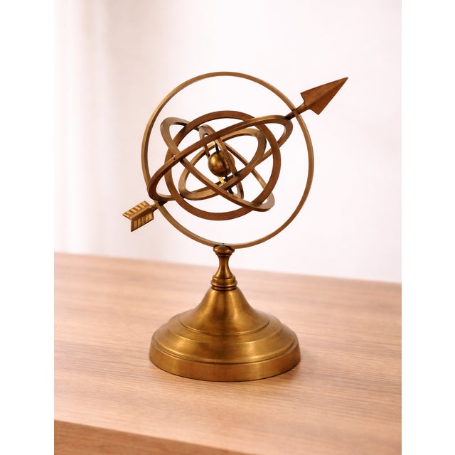 Celebrate the timeless beauty of science and exploration with this vintage handmade brass armillary sphere, featuring...