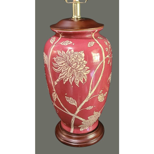 The Vintage Asian Inspired Painted Chrysanthemum Floral Red Table Lamp is a unique and elegant piece featuring an Asian-...