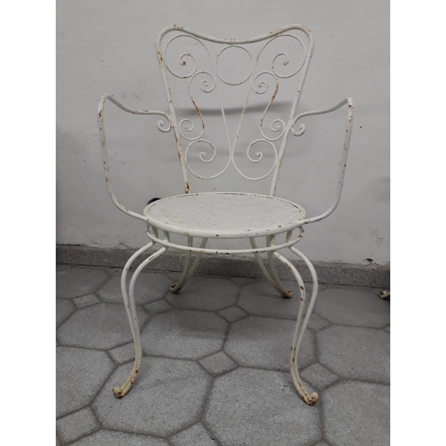 Four beautiful, high-quality wrought iron chairs from the 1950s, very sturdy, purchased from a villa where they were used...