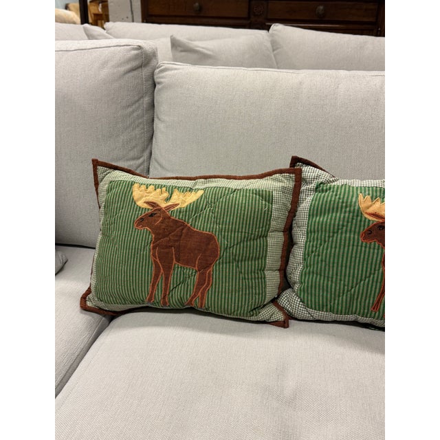 Design Plus Gallery presents a Set of Four Moose Appliqué Pillows from White Arrows Home. The pillows have a green gingham...