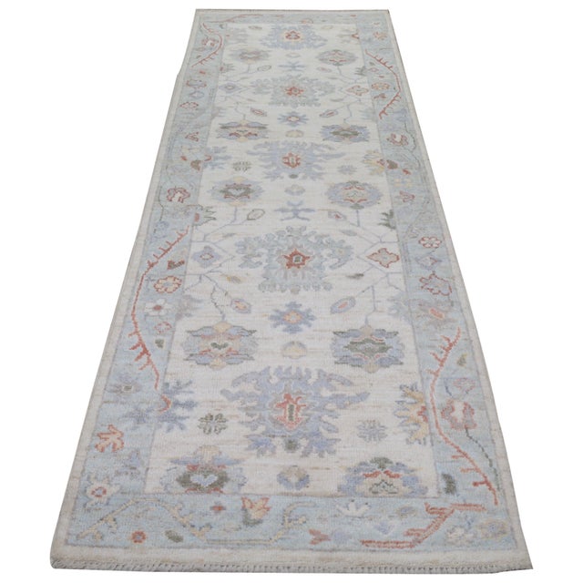 Hand-knotted with care using traditional rug making techniques, this wool rug blends timeless craftsmanship with a modern...