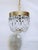 This beautiful vintage crystal chandelier combines classic elegance with timeless sophistication. Featuring a ribbed brass...