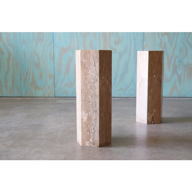 A pair of travertine hexagonal end tables. Considerable height so these could be used as minimalist night stands, end...