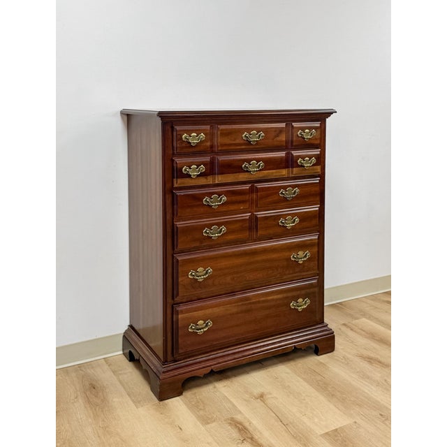This handsome vintage American Drew five drawer tallboy dresser is a well-crafted and practical bedroom storage find....