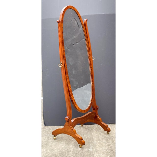 A fine large English cheval or full-length dressing mirror, in the Queen Anne style, from the Edwardian era, featuring an...