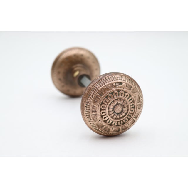 Antique Vernacular style passage radial door knobs made of polished brass. Priced as a pair of knobs with a spindle. Good...