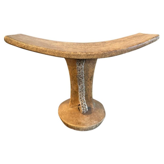 A beautiful hand carved African headrest with lovely patina. Circa 1950. We only select the best. Own an Andrianna...
