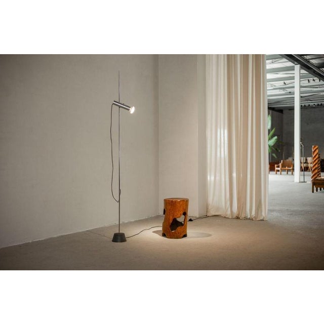 The model 1074 floor lamp, designed by the renowned italian designer gino sarfatti in 1957, is a prime example of...