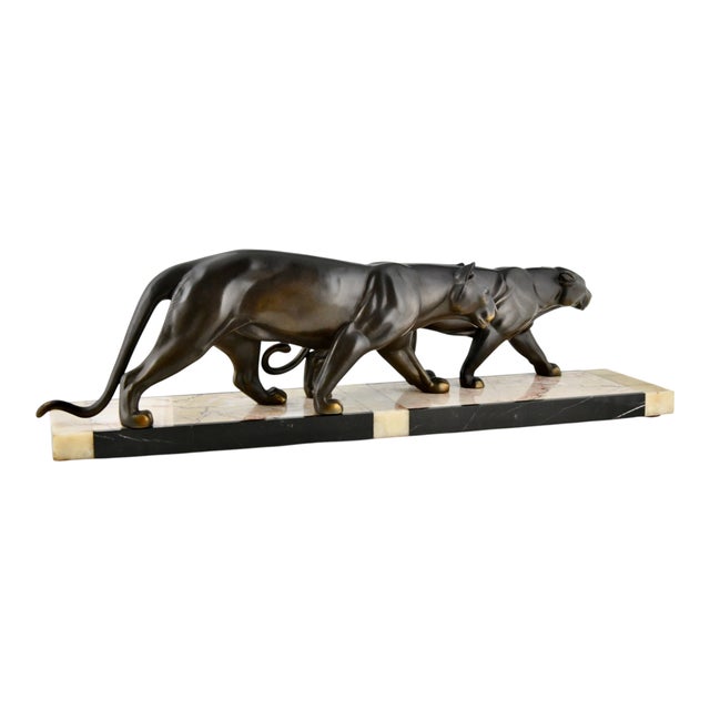 This striking Art Deco sculpture of two panthers was created by M. Leducq in 1930. The composition presents two panthers...
