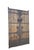 This pair of antique screen door panels showcase a striking blend of rustic wood and intricate, hand-forged ironwork....