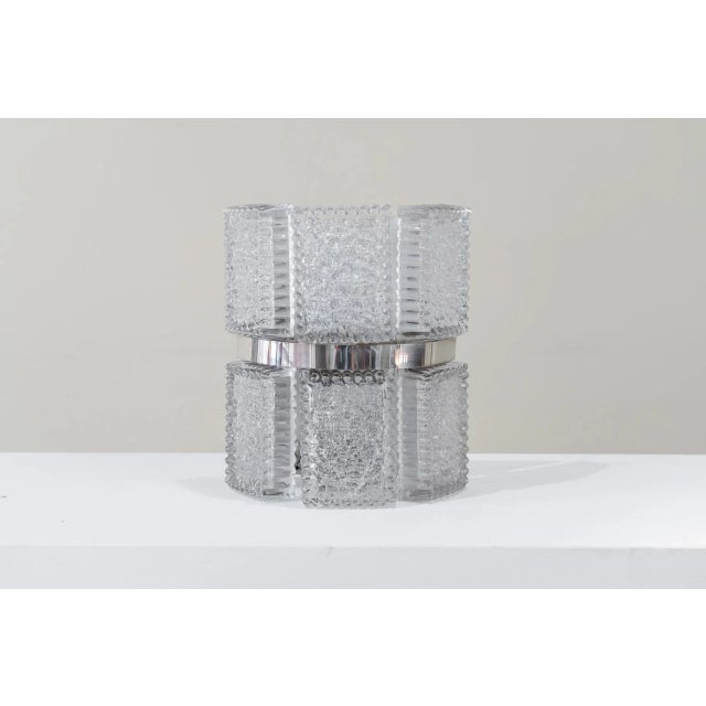 Wall light in steel and frosted glass with two lights. Transparent block type glass very fashionable in those years in...