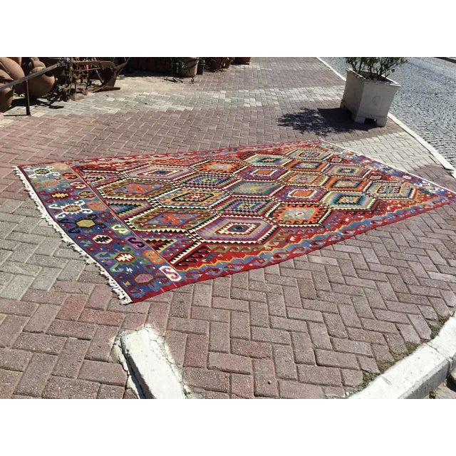This beautiful, vintage, handwoven Kilim is approximately 70 years old. It is handmade, of very fine quality hand spun...