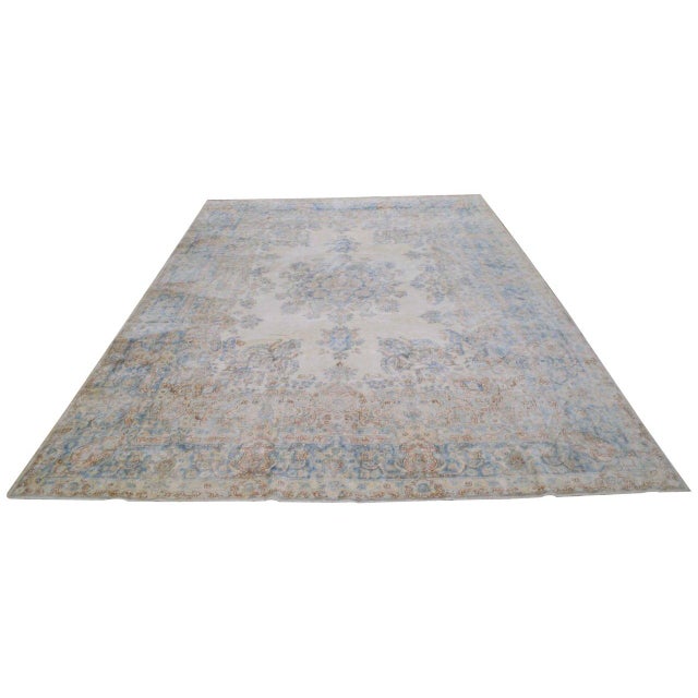 Hand-knotted with care using traditional rug-making techniques, this wool rug blends timeless craftsmanship with a modern...
