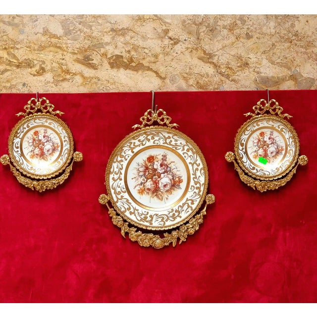 This elegant set of three Baroque-inspired wall décor pieces features delicate rose artwork surrounded by a sophisticated...
