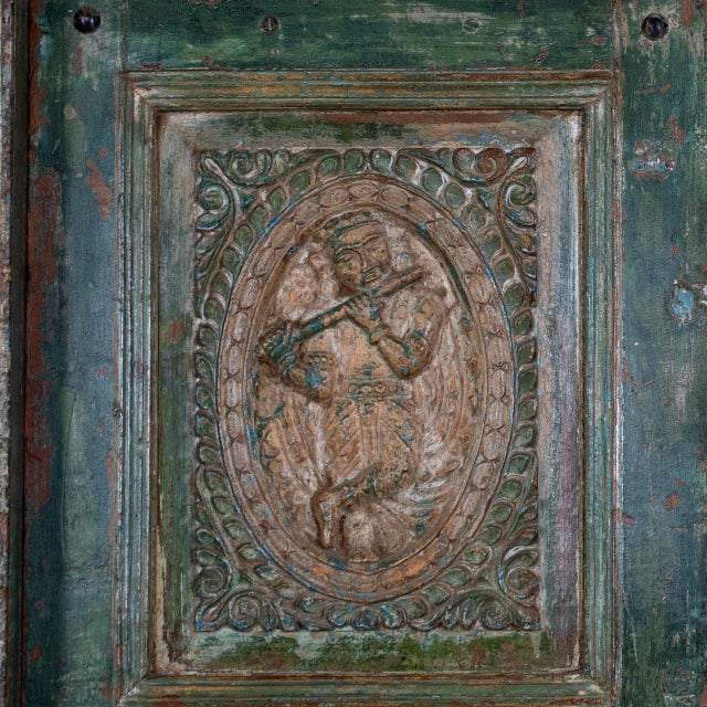 This Antique Indian Carved and Painted Teakwood Door, c. 1880–1900, showcases the vibrant decorative traditions of...