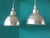 Set of two brushed aluminum pendant lights. They have been rewired and take maximum 75 Watts. European Plug (up to...