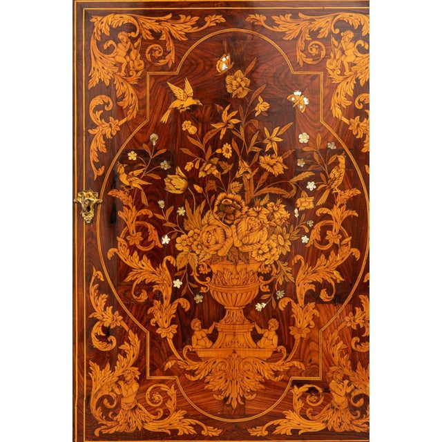 An exceptional art cabinet crafted in the 18th century, conceived as a tribute to the opulence and refinement of the 17th-...