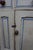Authentic 19th century Welsh pine cupboard featuring a cream painted exterior with a contrasting sky blue plank back. The...