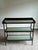 Elegant tiered serving console or dry bar designed by Jacques Garcia for Baker Furniture, showcasing the designer’s...