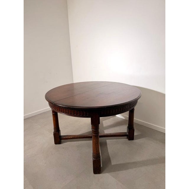 Beautiful Old New England oval dining table , crafted in dark-stained wood with a rich, warm finish. The table features an...