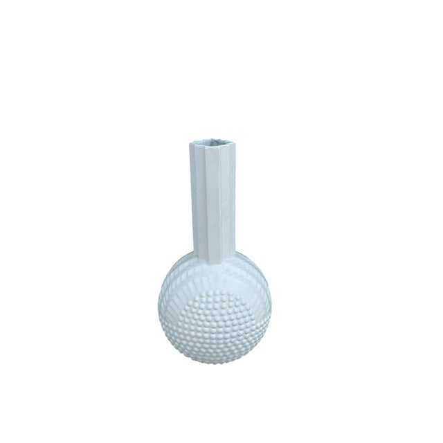 The vase is available in a white ceramic version and a black ceramic version. This piece has an attribution mark, I am...