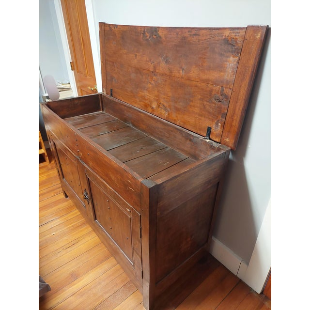 This exceptional late 19th-century French Provincial cabinet seamlessly blends rustic charm with versatile storage....