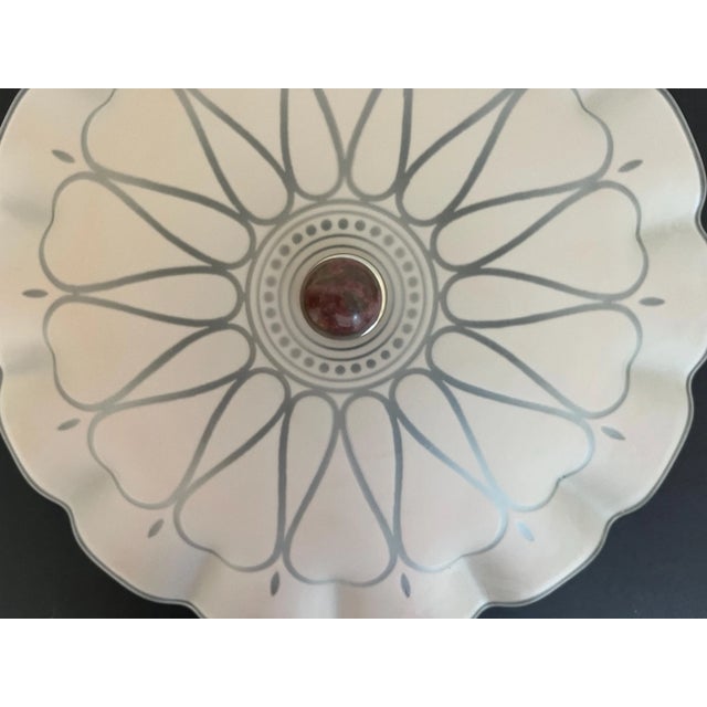 Lovely 1940s frosted glass flush mount light in matte soft pink with transparent heart-shaped rays, central sunburst, and...