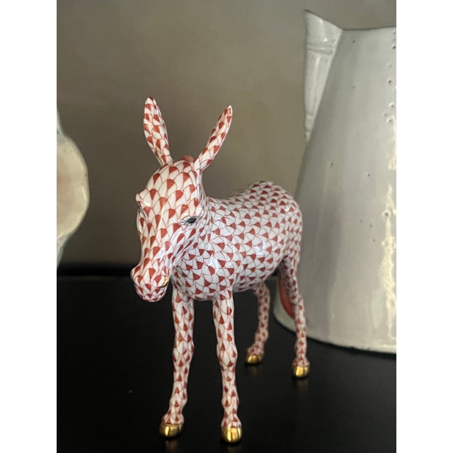 Herend hand painted porcelain donkey figure accented with a fishnet pattern and 24k gold painted hooves, made in Hungry in...