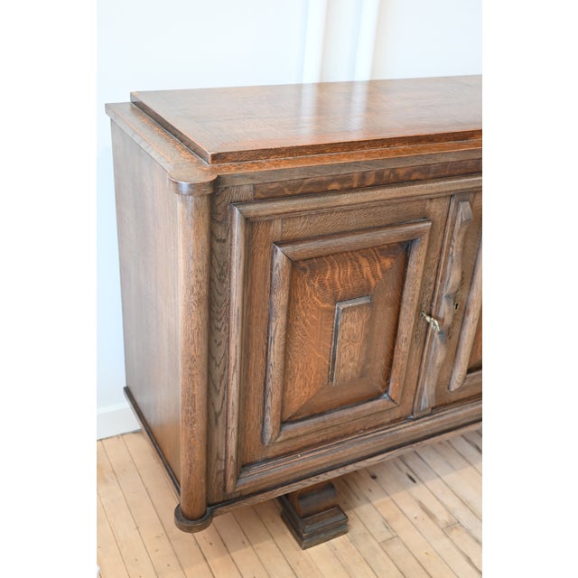 Statement Art Deco period sideboard in oak. Great lines in the style of innovative French designer Charles Dudouyt. Solid...