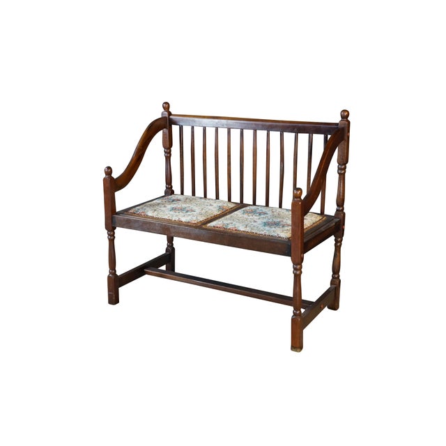 This vintage mahogany settee showcases a timeless American Country and farmhouse design, highlighted by a classic spindle-...