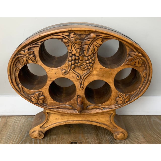 Vintage Enkeboll Designs wooden tabletop wine rack, featuring an ornate carved grapevine motif that holds up to six bottles