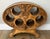 Vintage Enkeboll Designs wooden tabletop wine rack, featuring an ornate carved grapevine motif that holds up to six bottles