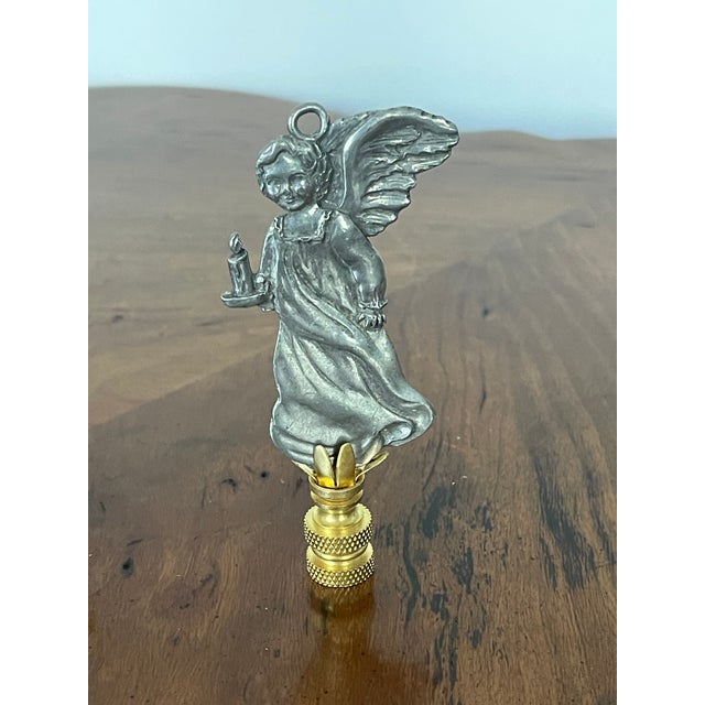 Vintage Angel with candle lamp Finisl. On brass base.