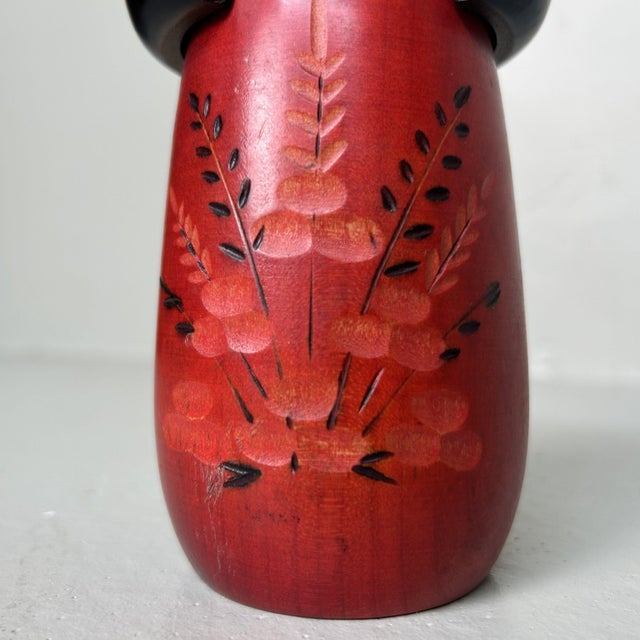 Vintage kokeshi doll by Masae Fujikawa. Dimensions: Height 19 cm, diameter 9 cm. This elegant kokeshi features exquisite...