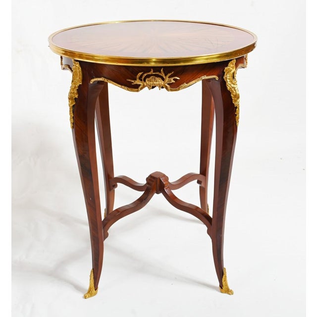 Gorgeous pair of French side tables in the Regence manner. Feature original ormol fixtures. Clean and minimal design...