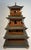 A fantastic large scale Chinese wooden model of a pagoda with four tiered flared eaves, sliding wood doors and tinkling...