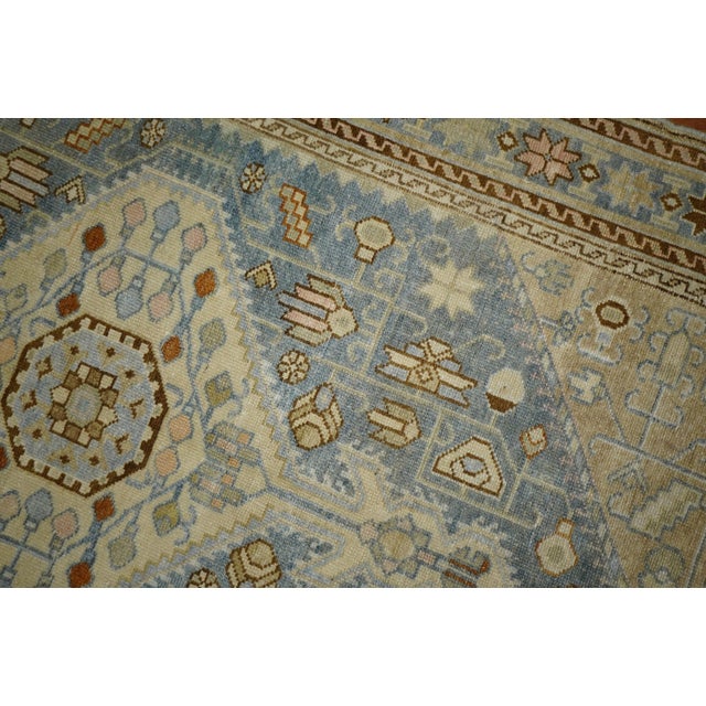 Highly decorative antique early 20th century Persian Malayer rug. Light blue field with dominant accents in ivory and...