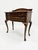 A charming early 20th century bow-fronted side table, featuring a shaped top with a raised gallery back. The piece is...