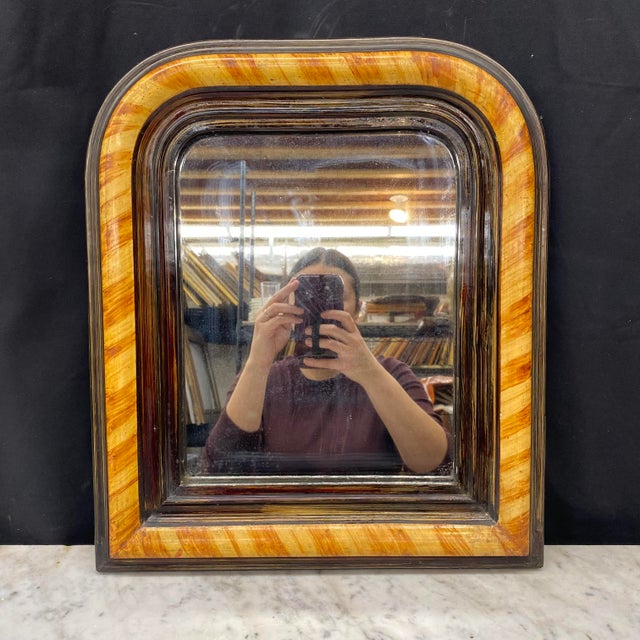 Elegant French Louis Philippe mirror featuring the period’s distinctive rounded upper corners and clean, architectural...