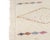 Delicate tribal symbols scatter across an ivory field like a hand-drawn constellation, each tiny motif rendered in a soft,...