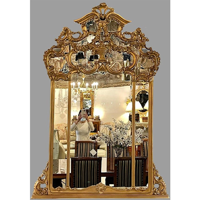 Giltwood over the mantel mirror. This theatrical wall or console mirror is simply stunning and certain to add a fine...