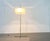 Mid-century floor lamp from Switzerland with a particularly minimalist base. The distinctive feature of this lamp is its...