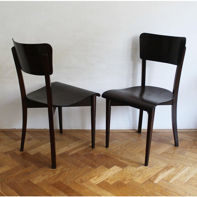 This rare pair of h-353 chairs was designed by jindřich halabala and produced by up brno during the 1930s, a period widely...
