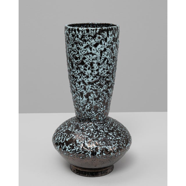 This 20th Century French fat lava ceramic vase features a bold, sculptural form and a richly textured glaze emblematic of...