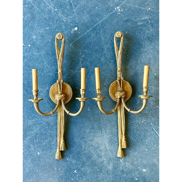These magnificent vintage wall sconces are a masterful celebration of French Regency elegance and Neoclassical drama....