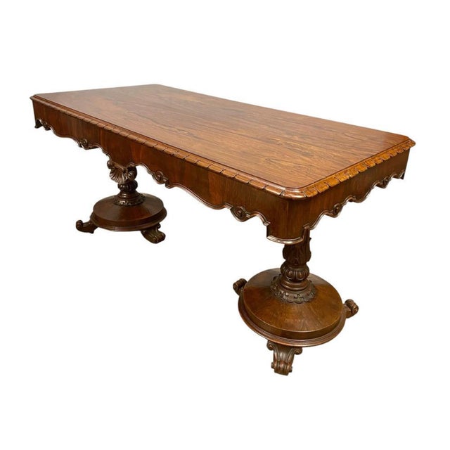 A handsome William IV style mahogany library table of impressive scale and quality, dating to the early twentieth century...