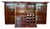 Impressive vintage Chinese hand carved bar cabinet features heavily carved garden scenes and figurals on 4-sides including...