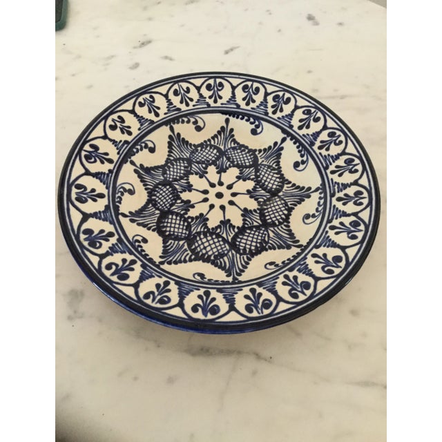 Gorgeous hand painted in blue and white glassed ceramic wall plate signed on the back, made is Spain with gorgeous motif...