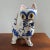 Whimsical mid-century Italian hand painted blue and white glazed terracotta cat wearing a bowtie. Has nice weight to it...
