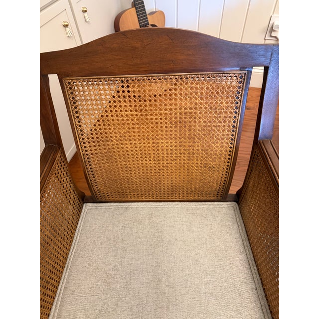 Warm wood, woven cane, and fresh neutral upholstery come together in this inviting Drexel Heritage Lineage Collection...